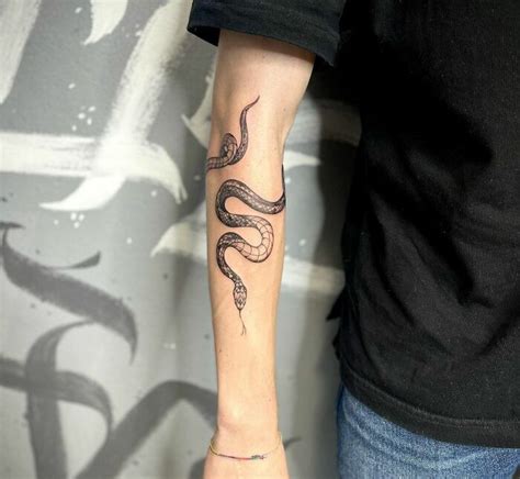 snake wrapping around arm|85 Snake Tattoos That May Have You Wrapping Around The Idea